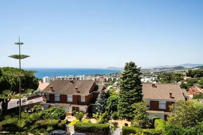a view of a city with houses and trees at Casa Nina junto Barcelona Centro y playa in Teià