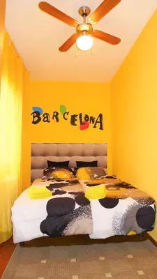 a bedroom with a bed with a sign on the wall at Carmen Seaview & Beach - Apartment in Montgat