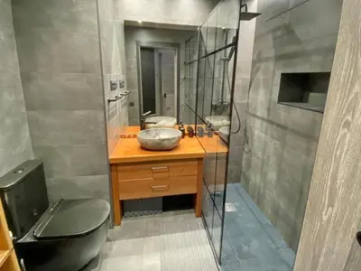 a bathroom with a sink and a toilet and a mirror at Gaudi Comfort in Barcelona