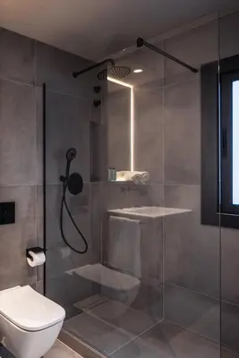 a bathroom with a shower and a toilet at Lovely 6 BR Flat in L'Eixample in Barcelona