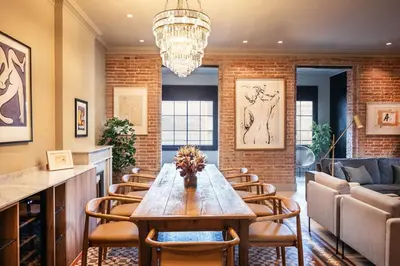 a dining room with a table and chairs at Lovely 6 BR Flat in L'Eixample in Barcelona
