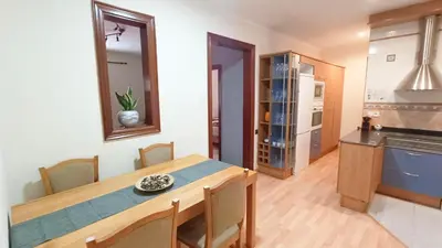 a kitchen and dining room with a table and chairs at My best house BCN in Barcelona