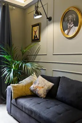 a couch in a living room with a mirror at Sagrada266 by chicStays in Barcelona