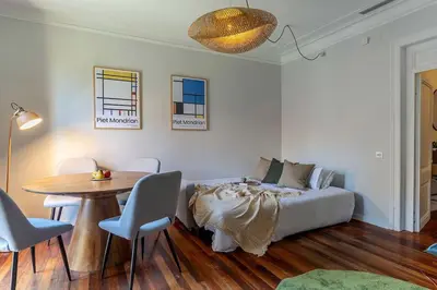 a bedroom with a bed and a table and chairs at Canela Homes BARCELONA BRUC in Barcelona
