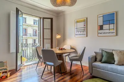 a living room with a table and a couch at Canela Homes BARCELONA BRUC in Barcelona