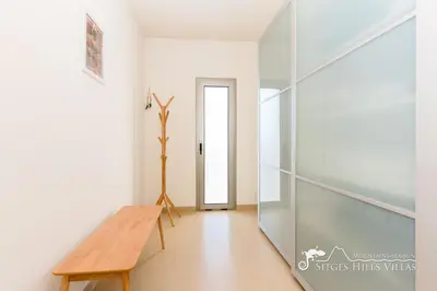 a ping pong table in a room with green curtains at Designer Villa Elodie with private pool and space in Olivella