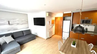 a living room with a couch and a table at Dúplex 2 hab con terraza by Prestigi in Terrassa
