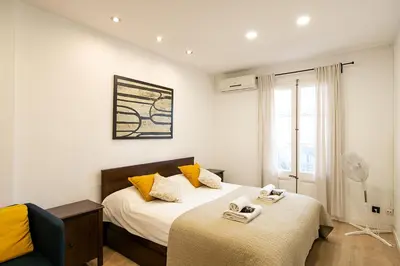 a bedroom with two beds with towels on them at Beautiful apartment with terrace in Barcelona in Barcelona