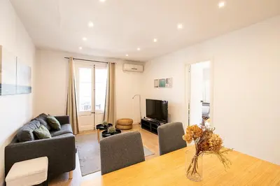 a living room with a couch and a table at Beautiful apartment with terrace in Barcelona in Barcelona