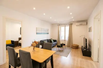 a living room with a table and a couch at Beautiful apartment with terrace in Barcelona in Barcelona