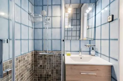 a bathroom with a sink and a shower at Avenida Gaudí View 2-Min to Sagrada in Barcelona