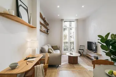 a kitchen with white cabinets and a sink at Pontone - 2 bedrooms and balcony in Eixample Dreta in Barcelona