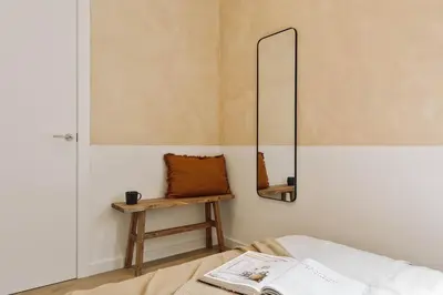 a bedroom with a bed with a book on it at Pontone - 2 bedrooms and balcony in Eixample Dreta in Barcelona
