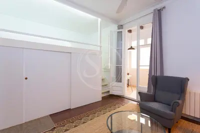 a kitchen with white cabinets and a dishwasher at Modern flat near Sagrada Familia in Barcelona