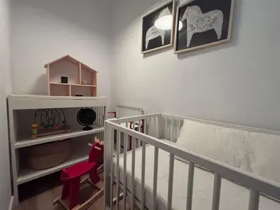a living room with a couch and a television at Modern flat near Sagrada Familia in Barcelona