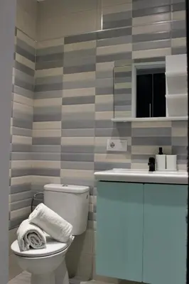 a bathroom with a toilet and a sink at Work Stay in Gavà