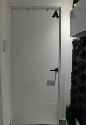 a white door with a handle in a room at Work Stay in Gavà