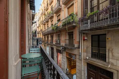 an alley in a city with buildings and balconies at Stay U-nique Apartment Boters in Barcelona