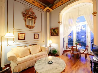 a living room with a couch and a table at Apartment Plaza de Catalunya - Pso- de Gracia by Interhome in Barcelona