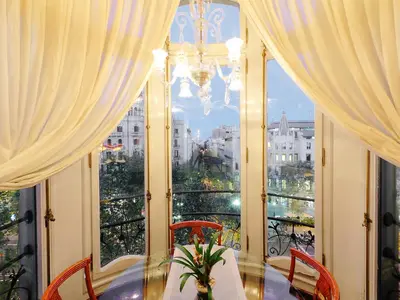 a dining room with a table and a large window at Apartment Plaza de Catalunya - Pso- de Gracia by Interhome in Barcelona