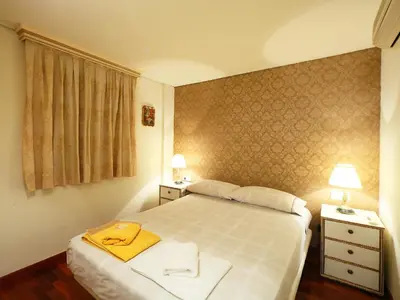 a bedroom with a bed with towels on it at Apartment Plaza de Catalunya - Pso- de Gracia by Interhome in Barcelona