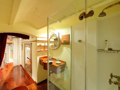 a bathroom with a glass shower and a sink at Apartment Plaza de Catalunya - Pso- de Gracia by Interhome in Barcelona