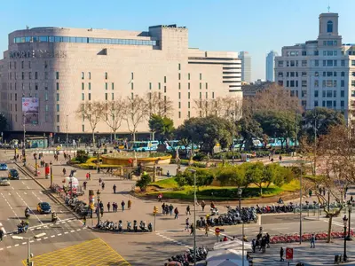 a group of people walking around a plaza in a city at Apartment Plaza Catalunya-Rda-Universidad by Interhome in Barcelona