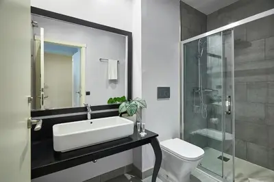 a bathroom with a sink and a shower and a toilet at BBarcelona Rogent Flats in Barcelona