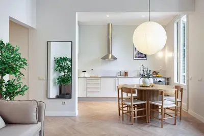 a kitchen and dining room with a table and chairs at Click&Flat Gaudi Dream II in Barcelona