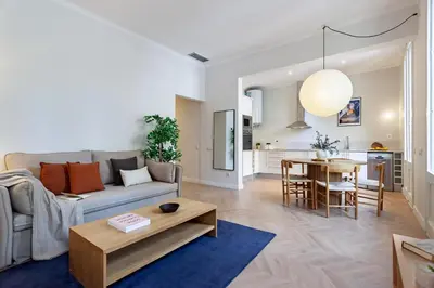 a living room with a couch and a table at Click&Flat Gaudi Dream II in Barcelona