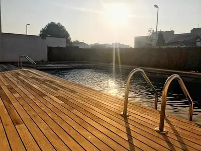 a wooden dock with a body of water at Casa familiar luminosa con piscina, cerca de la playa y parques, ideal para 6 personas en Cubelles - ES-332-5 in Cubelles