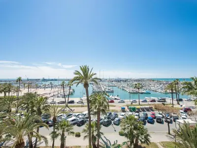 a view of a marina with palm trees at Ático Familiar Renovado Frente al Mar con Terraza y Vistas Panorámicas en Vilanova i la Geltrú - ES-332-2 in Vilanova i la Geltrú