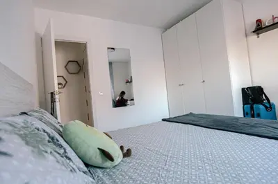 a bedroom with a bed with a teddy bear on it at Cotonat in El Arrabal