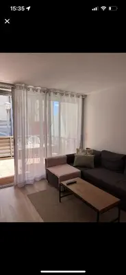 a living room with a couch and a coffee table at Piso centro Sabadell 2 pax in Sabadell