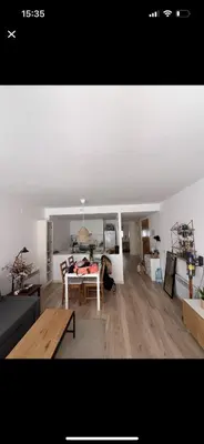 a living room with a couch and a table at Piso centro Sabadell 2 pax in Sabadell