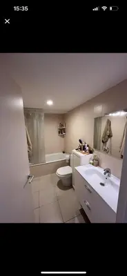a bathroom with a toilet and a sink and a tub at Piso centro Sabadell 2 pax in Sabadell