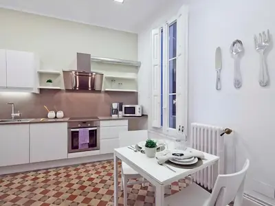 a living room with a couch and a table at Flateli Universitat in Barcelona