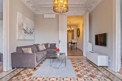 a living room with a couch and a table at Flateli Universitat in Barcelona