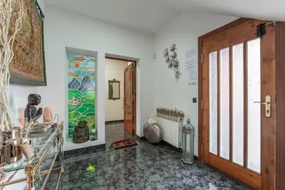 a room with a door and a painting on the wall at Casa de vacances Mary in Santa Eulalia de Ronsaná