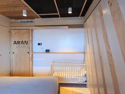 a bedroom with a bed and a window at AranEtxea in Bigues i Riells