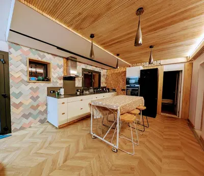 a kitchen with a table in the middle of a room at AranEtxea in Bigues i Riells