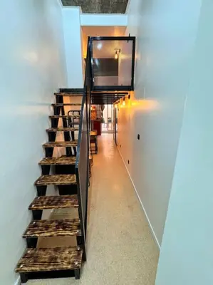 a staircase leading up to aasteryasteryasteryasteryasteryasteryasteryasteryasteryastery at Precioso estudio con terraza en Florida E1 in Hospitalet de Llobregat