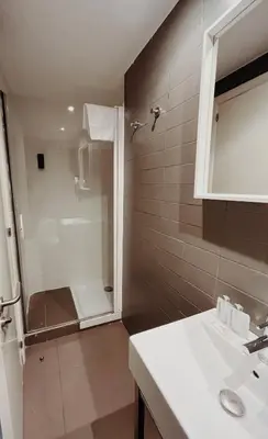 a bathroom with a shower and a sink at Apartamentos Express by gaiarooms in Barcelona