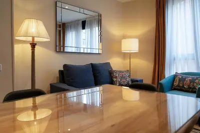 a living room with a table and a couch at Stay U-nique Apartment Putxet II in Barcelona