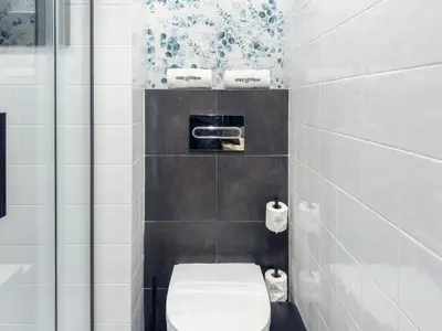 a bathroom with a white toilet in a room at Stay U-nique Apartment Putxet II in Barcelona