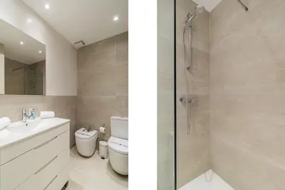a bathroom with a shower and a sink and a toilet at GuestReady - Lovely home in the heart of Barcelona in Barcelona