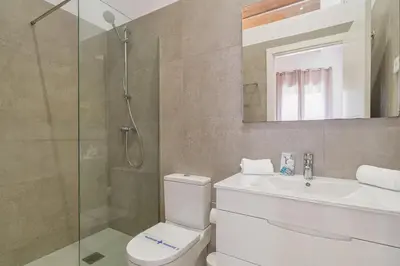 a bathroom with a shower and a toilet and a sink at GuestReady - Lovely home in the heart of Barcelona in Barcelona
