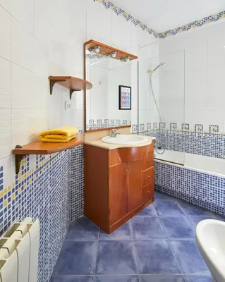 a bathroom with a sink and a mirror at Gran Via - 1 in Barcelona