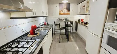 a kitchen with a stove and a counter top at Apartamento exclusivo junto Sagrada Familia Barcelona in Barcelona