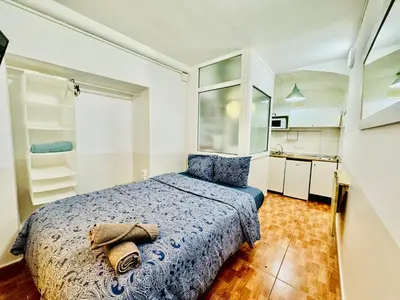 a bedroom with a bed with a towel on it at 033 Basic Barça 3 3 in Barcelona